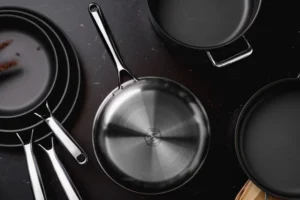 Onyx Cookware premium stainless steel pots and pans on a black surface. Onyx Cookware conversion