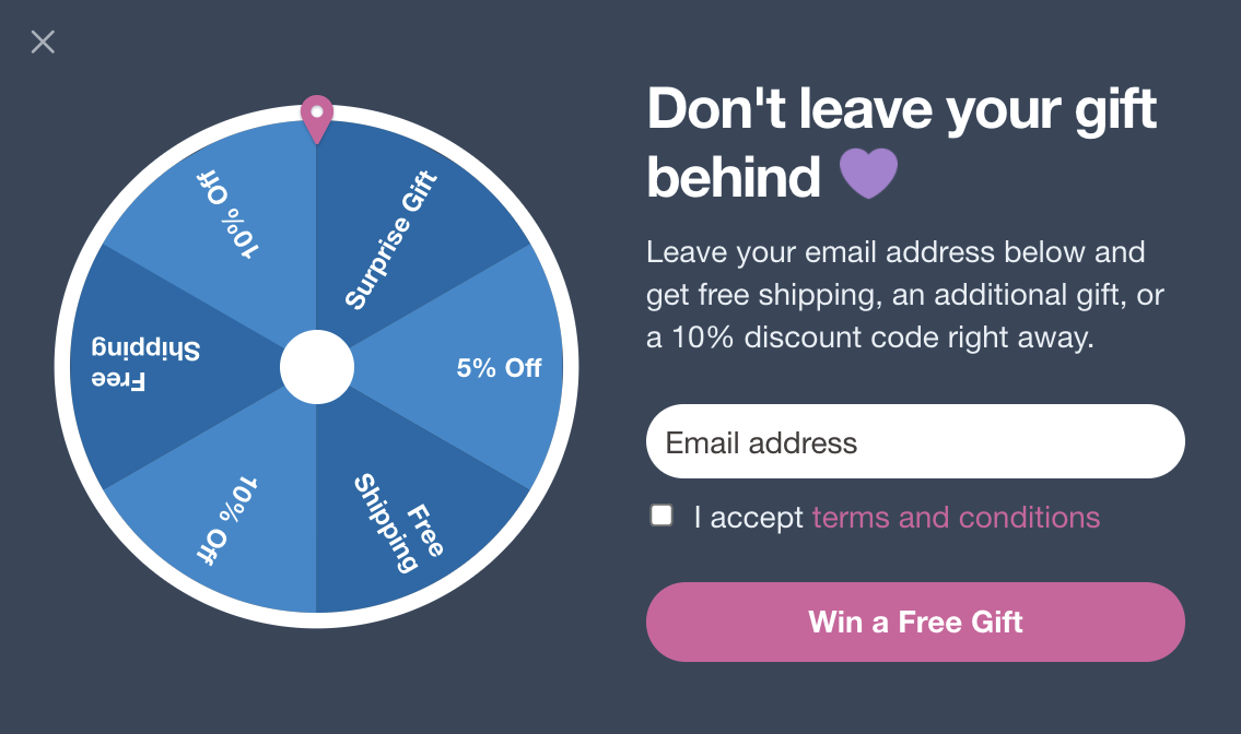 Spin to win popup that works an exit intent asking don't leave your gift behind
