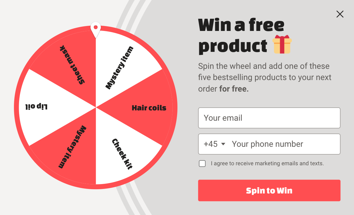 Spin to win popup example with red and gray design inviting people to win a free product